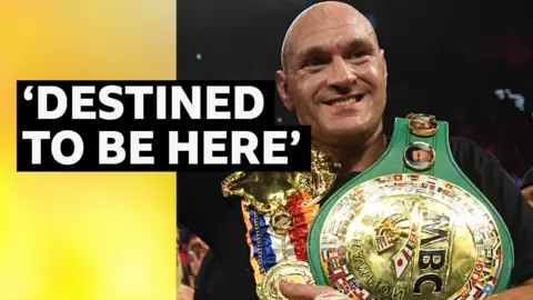 Tyson Fury celebrates win with belts after defeating Deontay Wilder