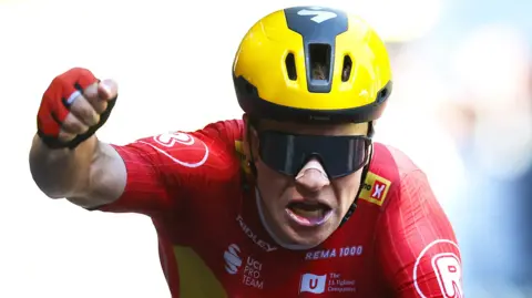 Jonas Abrahamsen celebrates winning stage 11 of the 2025 Tour de France