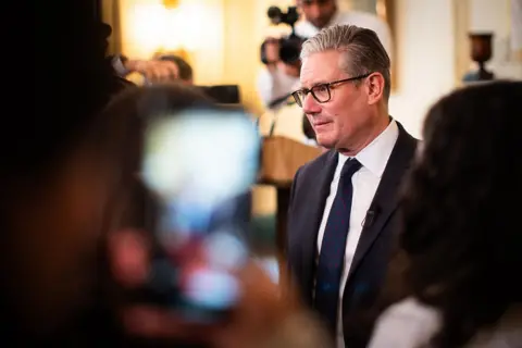 AFP via Getty Images Starmer speaking to guests at a reception