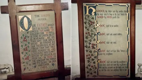 Photographs of two of the stolen artworks. On the left, The Lord's Prayer written in capital letters with a large illuminated letter O in green. On the right the Ten Commandments with a gold letter H at the top, both have floral decoration and are in dark wood frames