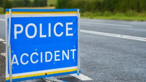 Getty Images A close up of a police sign saying 'police accident' on a roadside