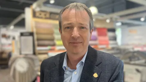 Kris Holland/BBC Martin Harris, CEO of Tapi Carpets