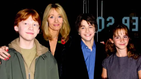 Getty Images Rupert Grint, JK Rowling, Daniel Radcliffe and Emma Watson at the premiere of Harry Potter and the Philosopher's Stone in 2001