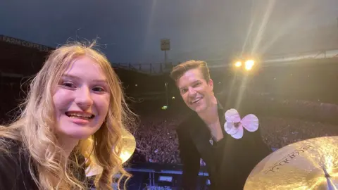 Grace/submitted Grace with The Killers frontman Brandon Flowers