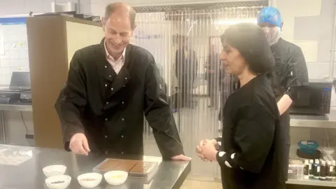 Duke of Edinburgh visiting chocolate company
