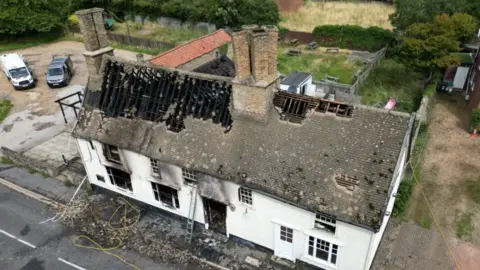 Steve Hubbard/BBC Drone shot of restaurant in Fordham after fire