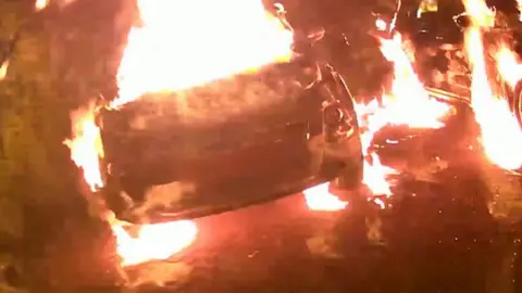 BBC CCTV of the burning cars