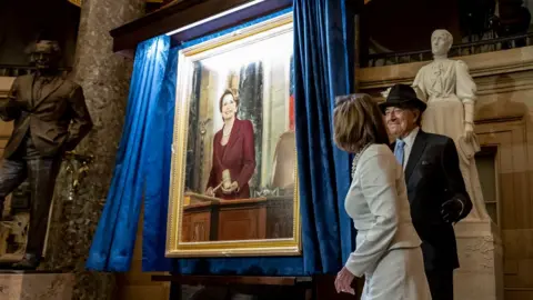 Getty Images the Pelosis were in Washington for the unveiling of Mrs Pelosi's portrait during Wednesday's hearing