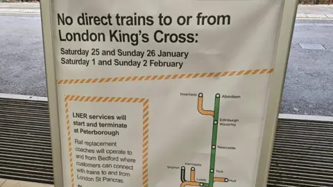 A sign in the entrance to Peterborough Railway station. It reads "No direct trains" - with information about the dates on the closures. There is also a small graphic of the train line with the different stops. 