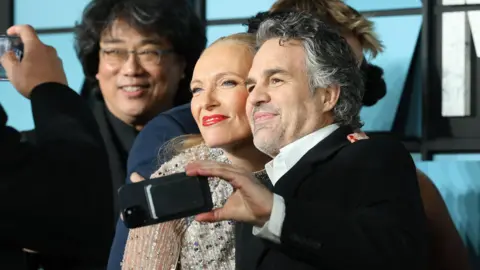 Getty Images Bong Joon-ho, Toni Collette and Mark Ruffalo attend the "Mickey 17" World Premiere at Cineworld Leicester Square on February 13, 2025 in London, England.