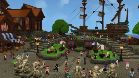a screen grab of the under development block-based fantasy game Hytale. A number of characters and buildings are seen in a comuterised world similar to Minecraft