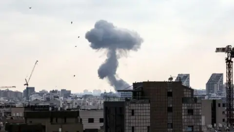 Smoke can be seen as during a missile attack from Iran on Israel, amid the Iran-Israel conflict, in Tel Aviv, Israel, June 22, 2025. 