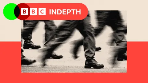A treated image treated image of soldiers walking, with only their lower legs visible 
