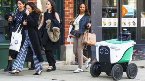 Getty Images A delivery robot on a sidewalk in Chicago