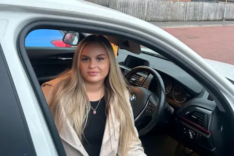 Hannah Robinson Hannah Robinson sitting in her car