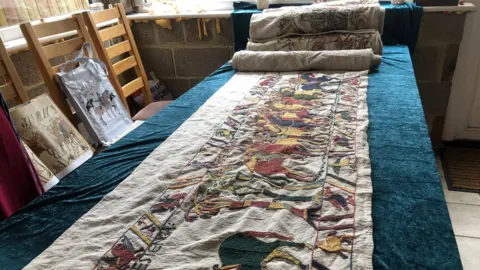 John Devine/BBC A replica of the Bayeux Tapestry which Mia Hansson hopes to complete by 2027, having started it in 2016.
