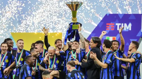 Inter's Lautaro Martinez lifts the Serie A trophy