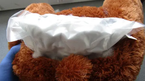 States of Jersey Police A brown teddy bear with a white bag hidden inside containing drugs