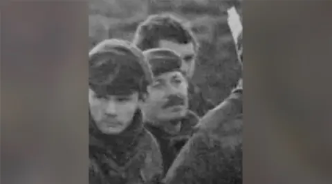 Tom Herring Black and white photo of three soldiers in army fatigues