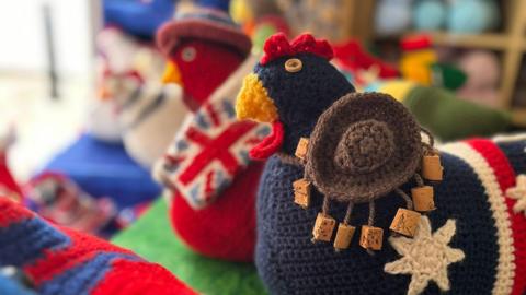 A view of the knitted chickens in the shop window