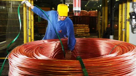 Man with copper piping 