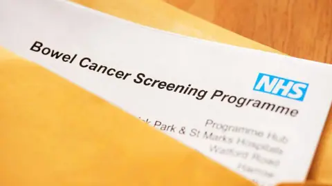 NHS screening program documents in a manilla folder.