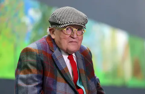 Getty Images British painter David Hockney poses at the Orangerie museum in Paris, on October 7, 2021