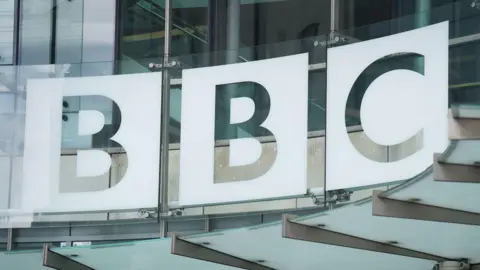 The BBC logo above the entrance to New Broadcasting House in London. 