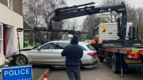 Paul Mandon Gassman The car being removed by a truck