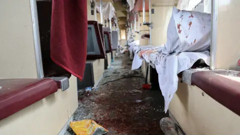 Dnipropetrovsk Regional Military Administration handout/EPA/Shutterstock Blood and glass lie on the floor of a passenger train damaged in a Russian attack near the city of Dnipro, 24 June 2025