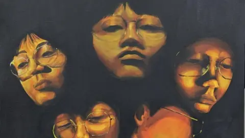 A piece of art work depicting four faces in shadow 