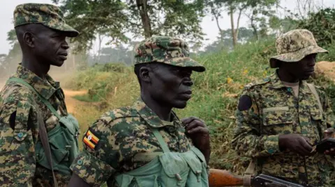 AFP via Getty Images Three soldiers are seen in uniforms in DR Congo North Kivu's province in December 2024