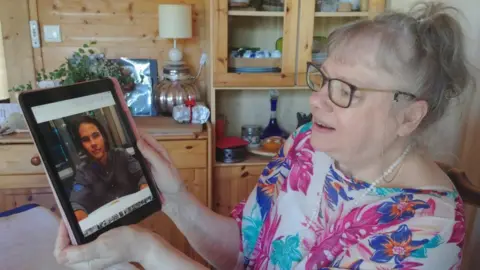 Supplied MiJo speaks to a student via video call