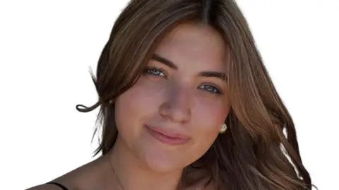 Georgie Winton Georgie Winton. She has blue eyes and long brown hair. She is smiling and looking directly at the camera. 