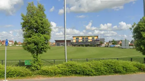Google View across Boundary Park with cricket nets in the foreground and a large pavilion building on the opposite side