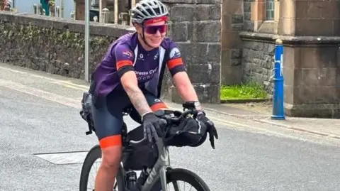 Christina MacKenzie Christina MacKenzie on the Trans Alba route, cycling her grey Liv bike in the sunshine