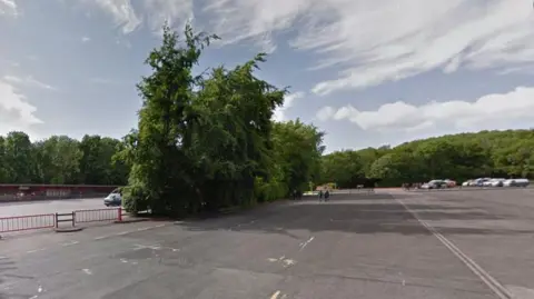 Google A large car park, mostly empty, belonging to the Humber Bridge Country Park. In the background are large trees.