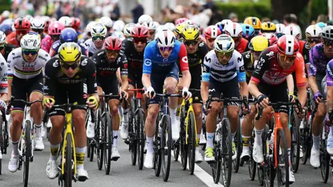 Dozens of cyclists vie for position in the opening stage of 2025's Tour de France.