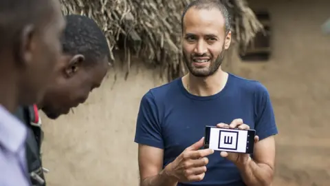 Rolex Joan Bardeletti Dr Andrew Bastawrous demonstrates the Peek Acuity app to villagers in Kenya