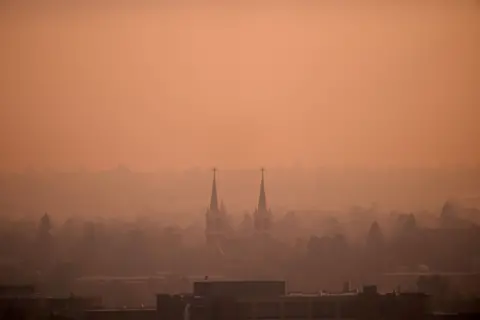 Reuters Wildfire smoke blankets the town of Spokane, Washington