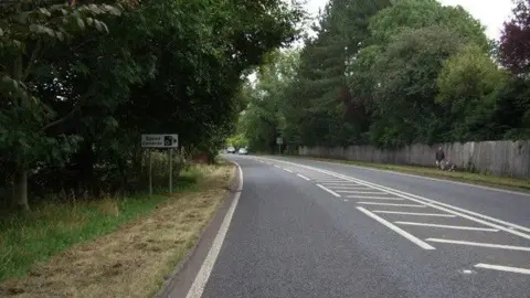 Geograph/ JThomas A65 near Gargrave showing double white lines and a bend in the road