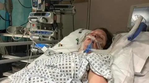 Cambridgeshire Constabulary Laura is shown receiving treatment in a hospital bed