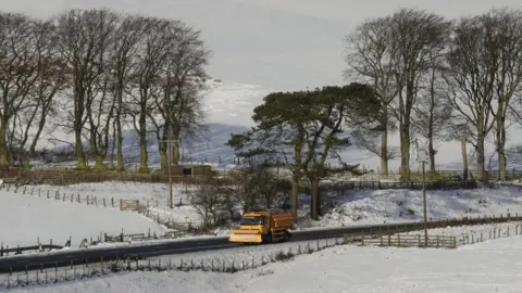 PA A gritter lorry on the A68 in the Scottish Borders as police are urging motorists to drive with "extreme caution" amid wintry conditions in Scotland