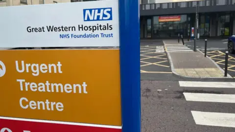 An image of a hospital entrance which says 'Great Western Hospitals'
