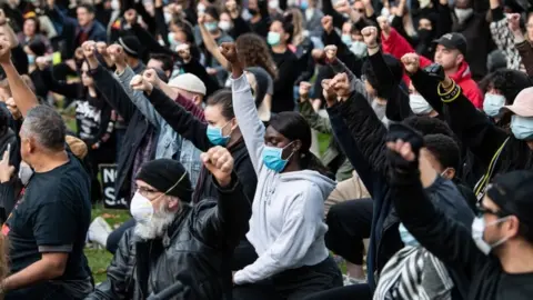 EPA Thousands protest in Sydney. Organisers urged attendees to try to observe social distancing