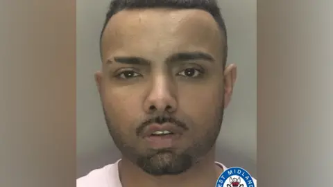Police mugshot of Sharjeel Shahzad, looking into the camera wearing a white t-shirt