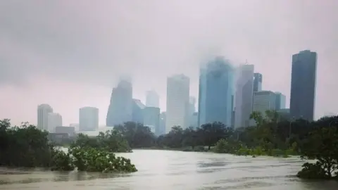 Reuters Mist covers central Houston after Hurricane Harvey inundated the Texas Gulf coast with rain and caused widespread flooding (27 August 2017)