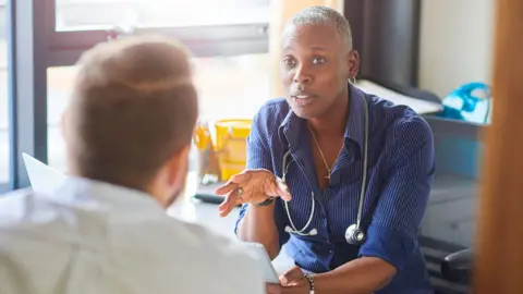 Getty Images GP seeing a patient