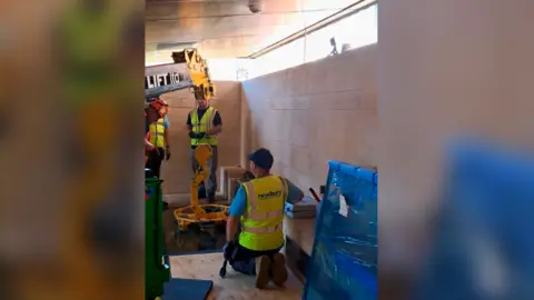 King Richard III Visitor Centre Workers and a small crane 