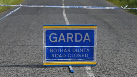 Garda police sign on a road 